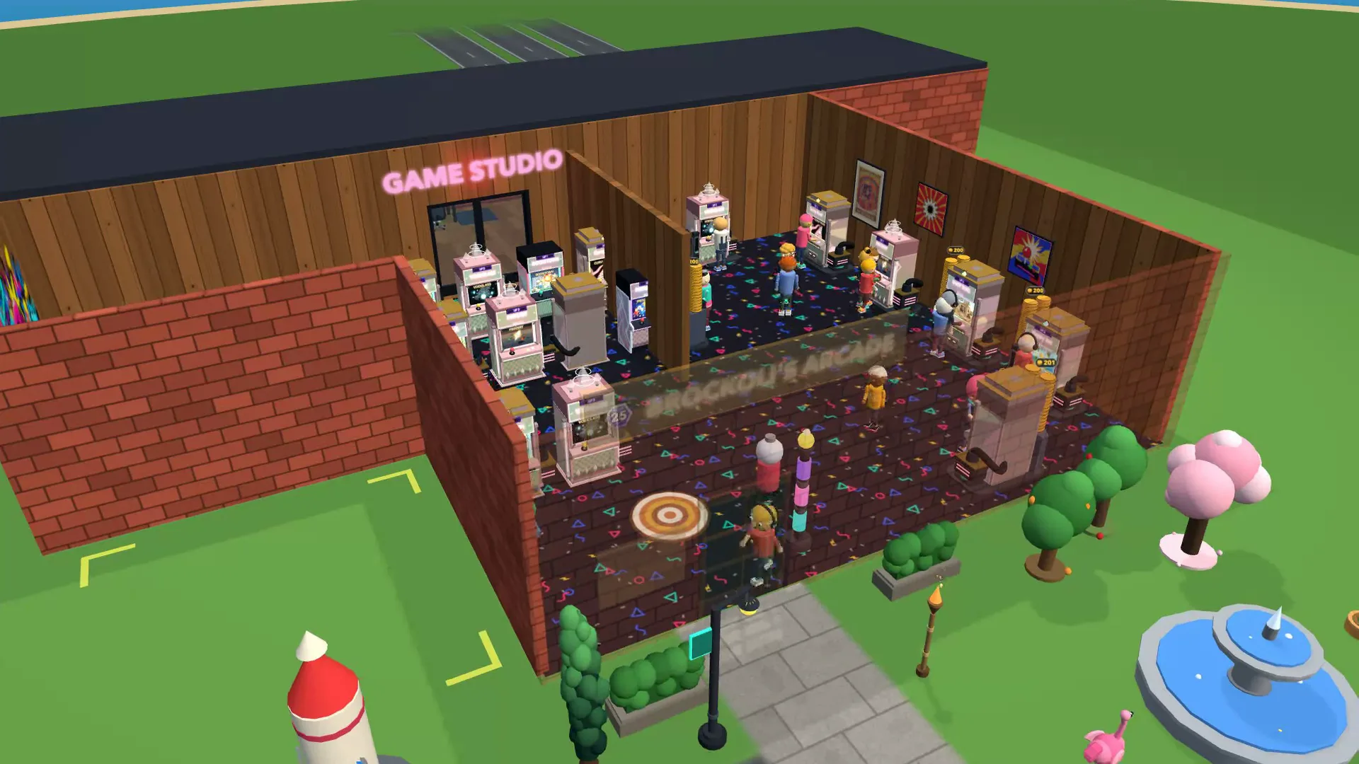 A large arcade seen from above, its floor packed with machines and visitors playing